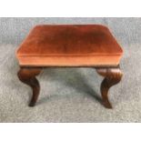 An 18th century walnut stool on cabriole supports. H.40 W.51 D.41cm.