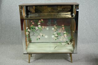 A 1960s Populuxe display cabinet. H.115 W.104 D.31cm. (Missing interior shelf and with some damage