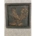 A modern carved panel of a cockerel. Painted black with a worn distressed finish. H.51 W.51cm.