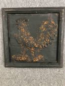 A modern carved panel of a cockerel. Painted black with a worn distressed finish. H.51 W.51cm.