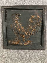 A modern carved panel of a cockerel. Painted black with a worn distressed finish. H.51 W.51cm.