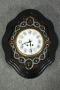 A Napoleon III French ox-eye clock with mother of pearl inlay. Each of white enamel bubbles with a