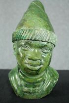 An African carved verdite bust of a man in a hat. H.26cm.