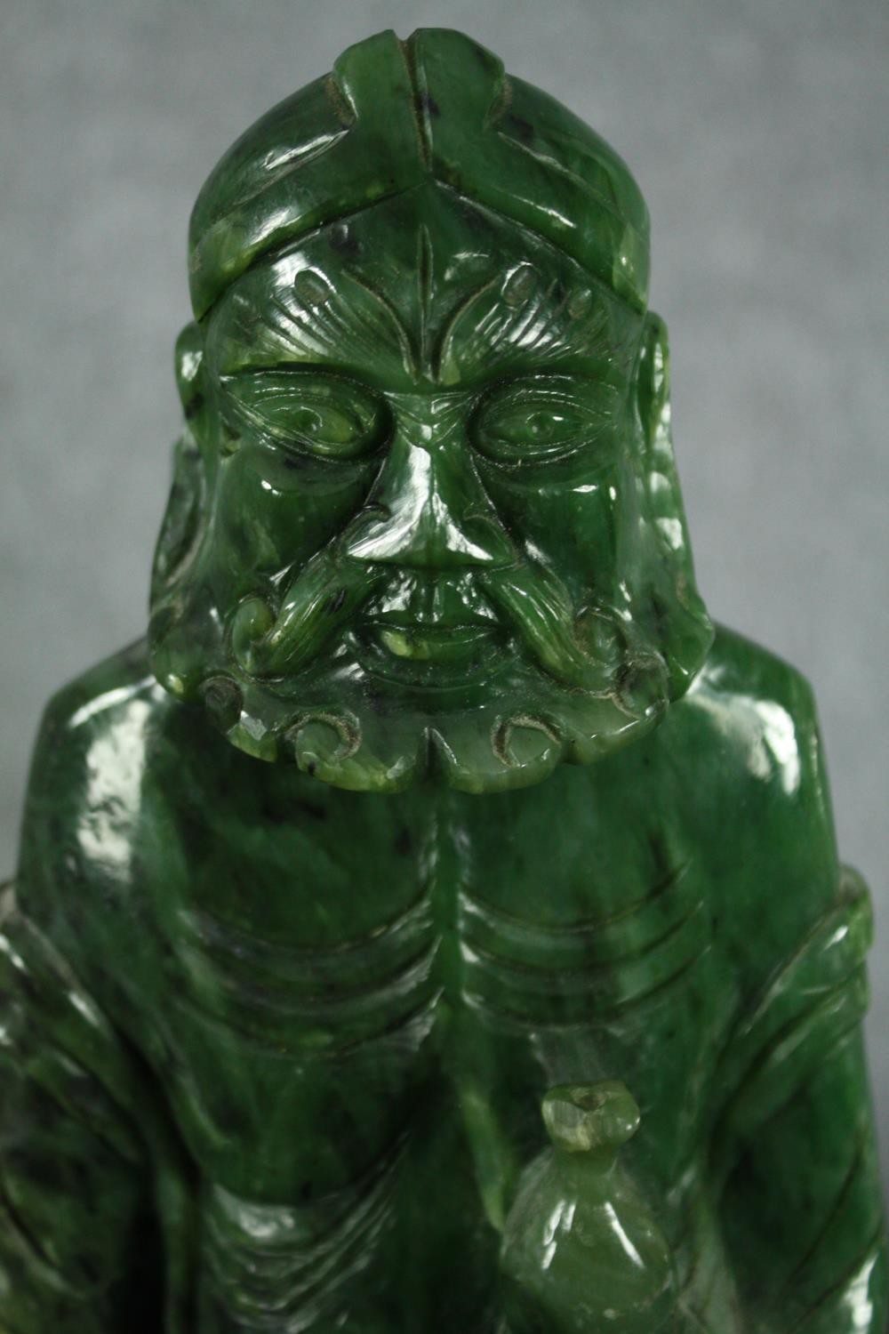 A 20th century carved spinach jade figure of a Chinese elder. H.43cm. - Image 5 of 5