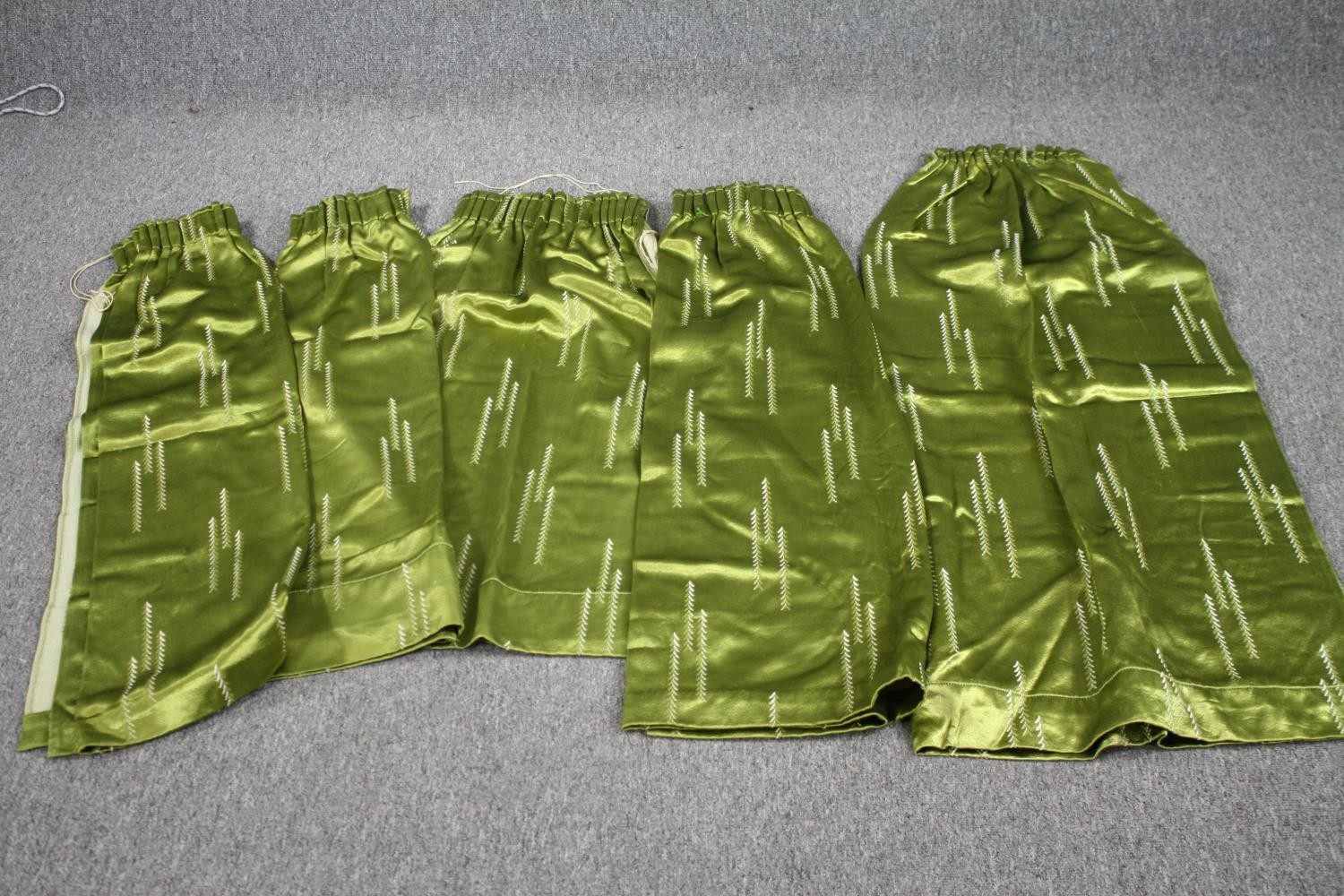 Five green silk velvet lined curtains. L.123 W.47cm. (largest) Proceeds from this lot will be