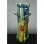 A Flemish Art Deco vase with a stylised watery blue and green glaze decorated with berries. Signed