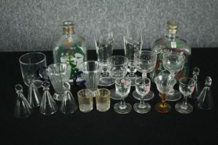 A collection of mixed 19th and 20th century glasses and bottles, including a pair of gilded cut