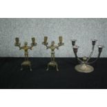 A pair of early 20th century medieval style brass bearded man candlesticks along with a silver