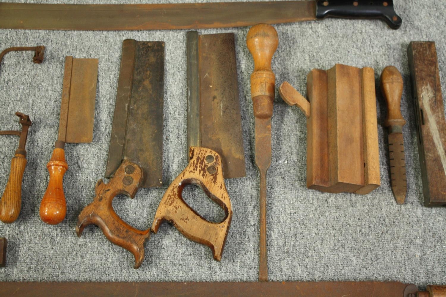 A large mid twentieth century machete and an assortment of wood working tools. The manchette with - Image 2 of 7