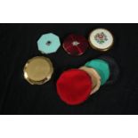 Four vintage compacts and with fabric covers. Dia.9cm. (largest)