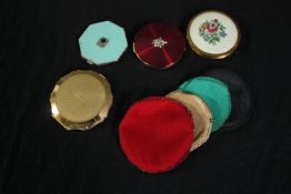 Four vintage compacts and with fabric covers. Dia.9cm. (largest)