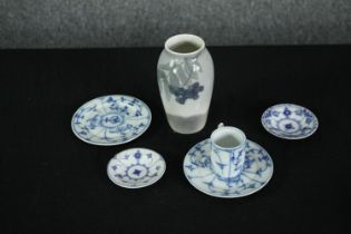 A collection of Royal Copenhagen and other porcelain, including a rowan berry vase, a miniature blue