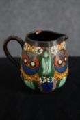 A Thoune owl jug. Swiss pottery. Signed on the base and numbered 30. H.10cm. Proceeds from this