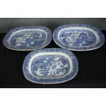 Three large blue and white Chinese willow pattern meat platters. H.38 W.47cm.