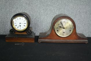 A 19th century ebonised and mahogany mantel clock along with a later clock. H.23 W.42cm. (largest)