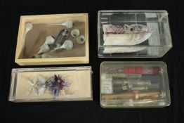 A pickled and dissected lung with labelled sections, a box of prosthetic glass eyes, a cased