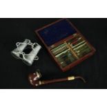 A pair of early 20th century collapsible aluminium binoculars along with a box of slides and a