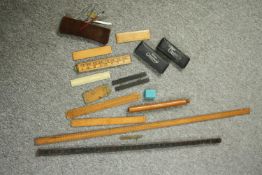 A mixed collection of scientific measuring equipment. Includes a folding and meter-long ruler and