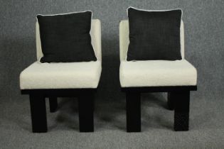 A pair of contemporary lounge chairs with their matching cushions. H.66cm. (each)