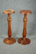A pair of turned pine torcheres. H.75cm. (each)