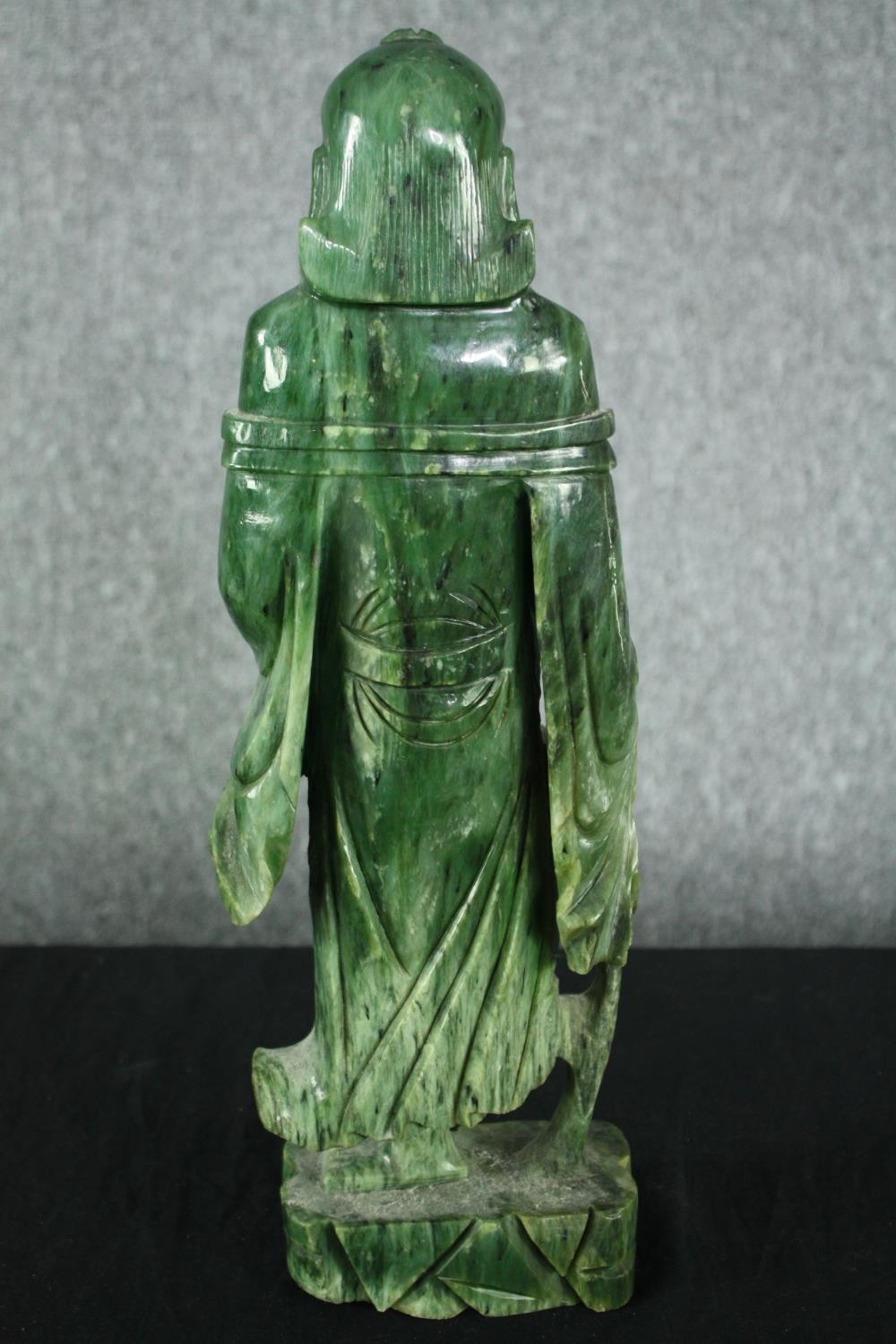 A 20th century carved spinach jade figure of a Chinese elder. H.43cm. - Image 4 of 5
