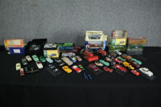 A collection of vintage toy Corgi cars. Includes an Aston Martin DB5. Condition varies from near