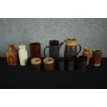 A mixed assortment of stoneware and earthenware pots and vases. Includes a matching coffee pot, jug,