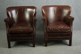 A pair of contemporary vintage style tub armchairs in tan leather and studded upholstery. H.73cm. (