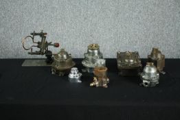 A collection of seven mid century cast iron and brass industrial switches and valves along with