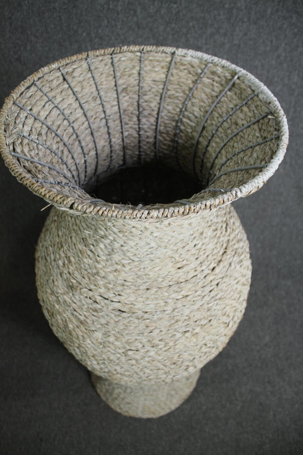 A pair of large modern rattan floor standing pots made from a metal frame with a weaved outer shell. - Image 3 of 6