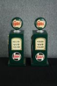 Two wooden storage cupboards in the shape of Castrol petrol pumps. Hand painted in a distressed