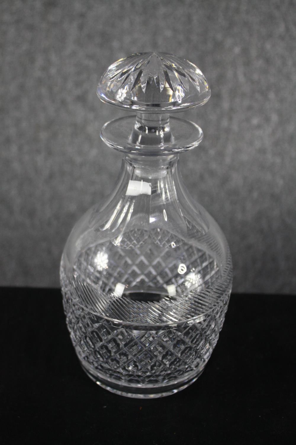 Four decanters with their stoppers. Cut glass with etched decoration. H.33cm. (largest) Proceeds - Image 3 of 3