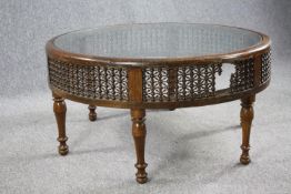 Coffee table, North African style hardwood with plate glass inset top. H.50 Dia.98cm.