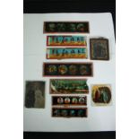 An assortment of Victorian Magic Lantern slides and portrait photographs. The slides include comical