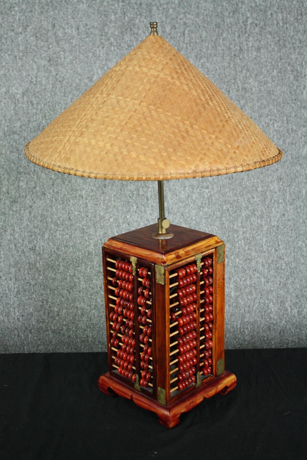 A table lamp fashioned from a four-part abacus with a woven rice picking hat type shade. The - Image 2 of 6