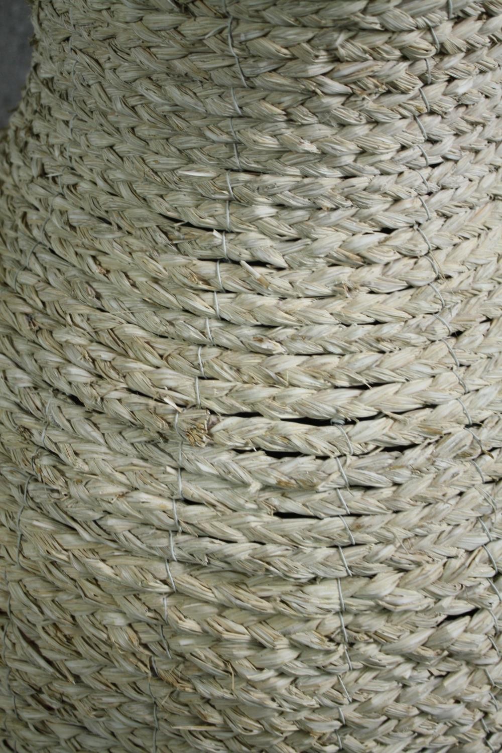 A pair of large modern rattan floor standing pots made from a metal frame with a weaved outer shell. - Image 6 of 6