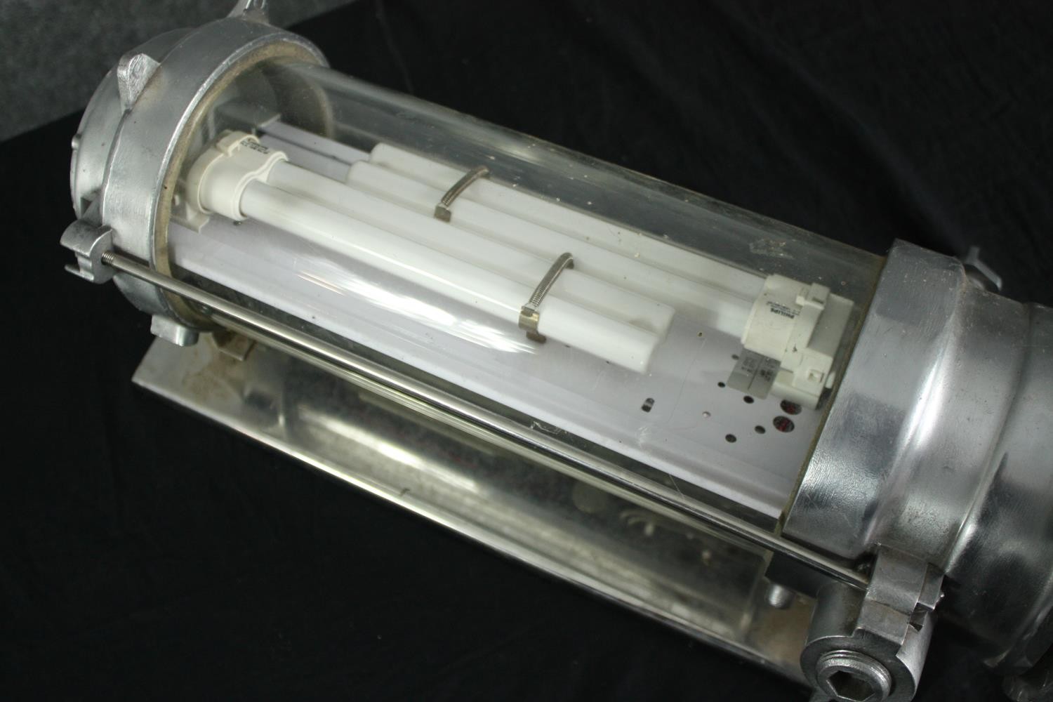 A mid century industrial aluminium and tubular glass wall light with fluorescent bulb. Originating - Image 4 of 4