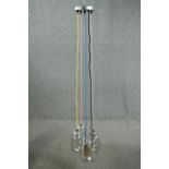 A ceiling light made up of a cluster of jam jars with coloured cable. L.147cm. Proceeds from this