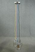 A ceiling light made up of a cluster of jam jars with coloured cable. L.147cm. Proceeds from this