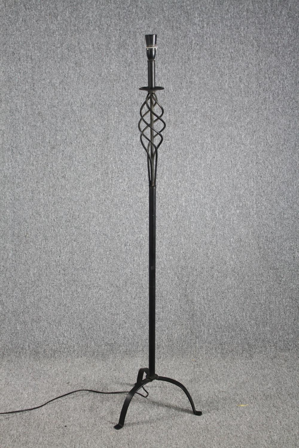 A metal floor lamp. H.148cm. Proceeds from this lot will be donated to the Sarcoma charity.