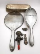 A Victorian silver dressing table set along with a silver handle and coral and silver child's