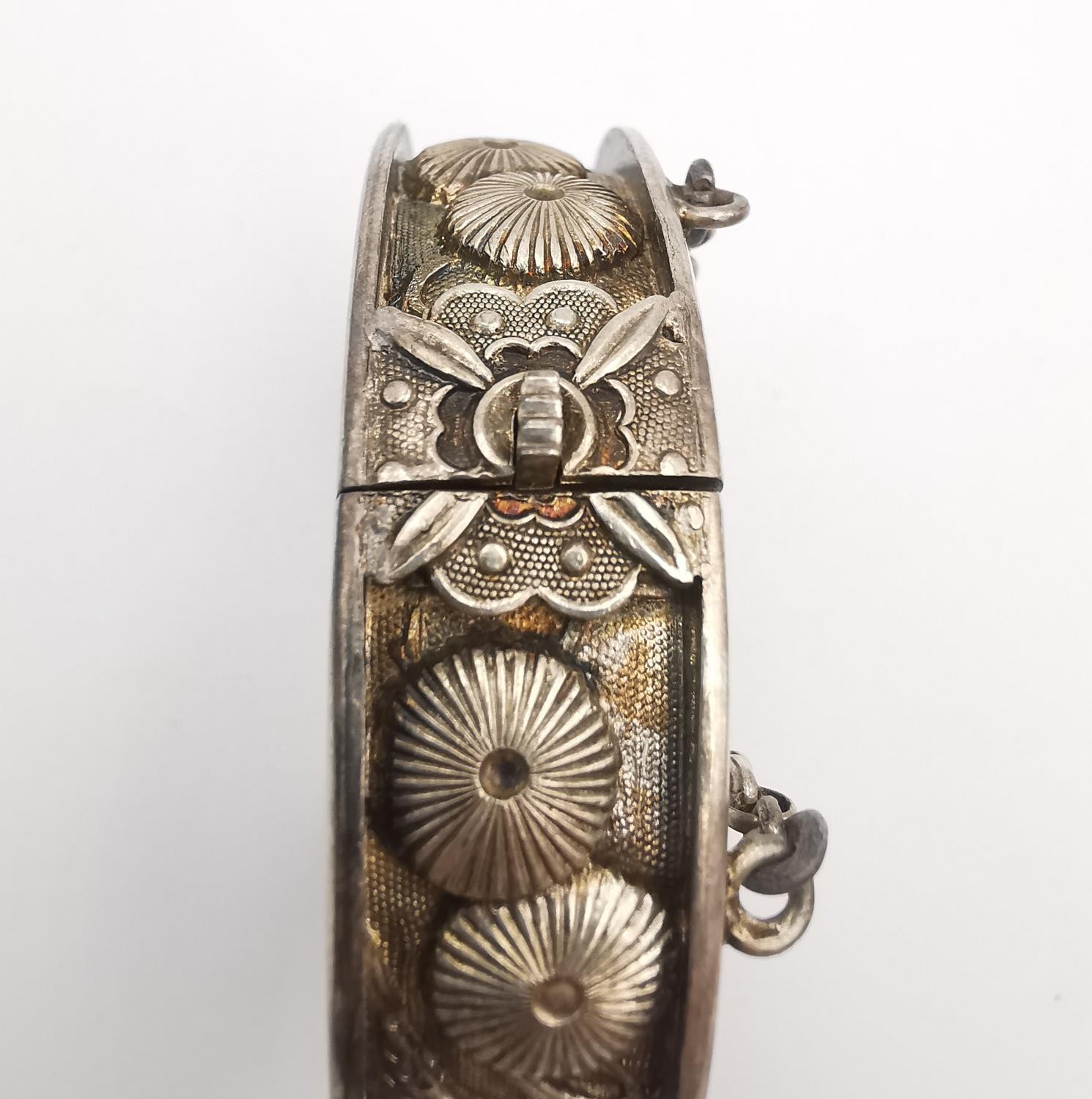 Two early 20th century repousse Chinese silver clip bangles, decorated with relief stylised - Image 4 of 8