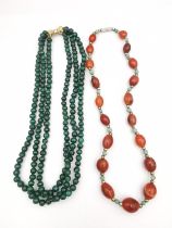 Two gemstone necklaces, including a three strand malachite bead necklace with white and yellow 14