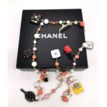 A boxed 2004 Chanel Cosmetics Sautoir necklace. Vintage Perfume and Cosmetics Charms long necklace