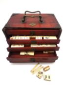 A 19th century rosewood cased bone and bamboo Mahjong set. (missing some tiles). The sliding door is