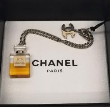 A boxed 2004 Autumn collection Chanel gold Chanel No. 5 charm bracelet. This bracelet features a