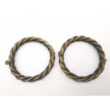 A pair of Chinese silver rope twist hinged bangles with screw clasp. The screw in the form of a