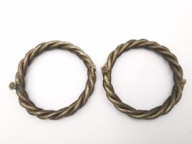 A pair of Chinese silver rope twist hinged bangles with screw clasp. The screw in the form of a