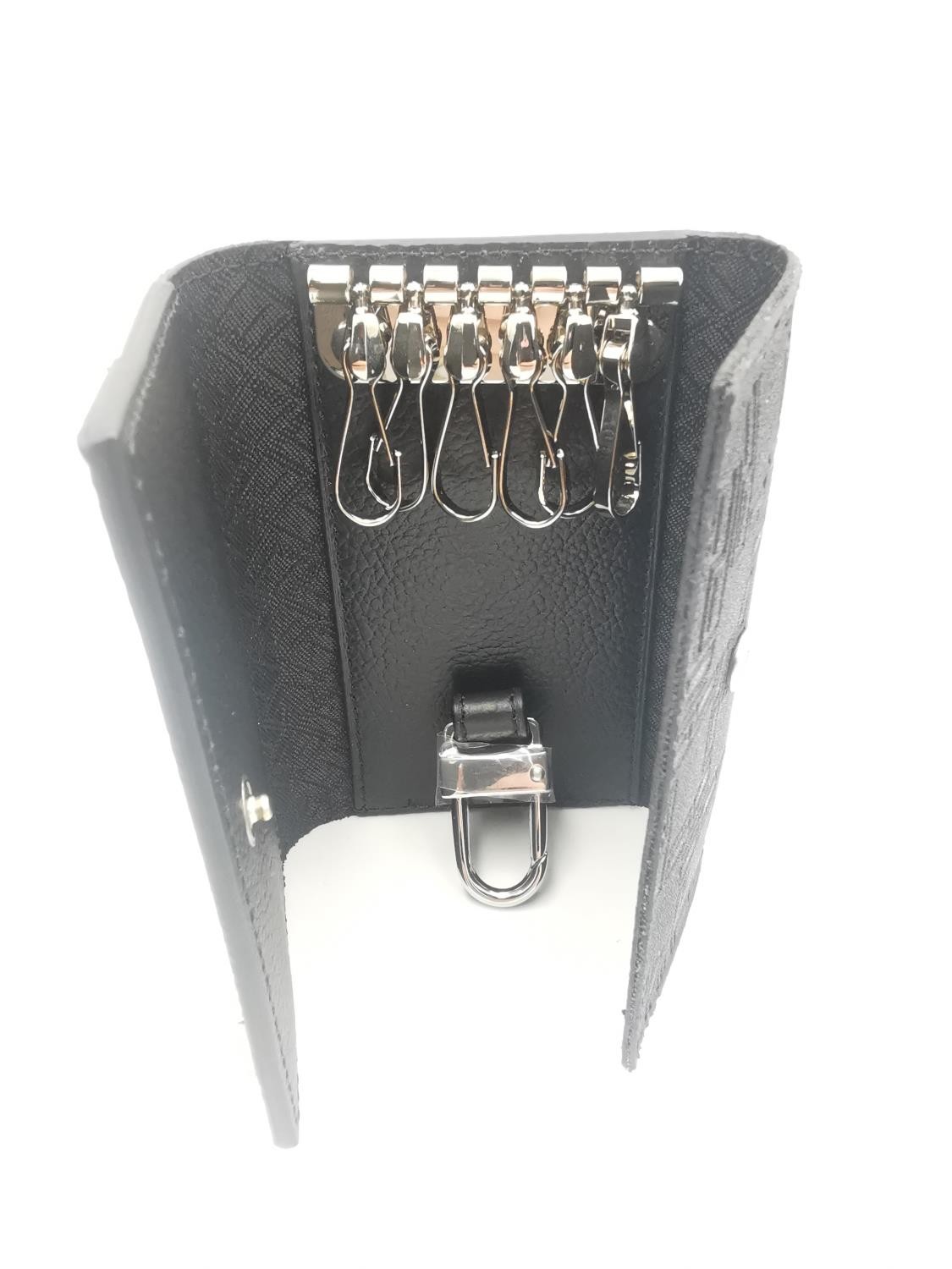 A boxed Dunhill key case and key holder black PVC and leather with impressed monogram design. (holds - Image 3 of 6