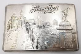 A vintage Chinese silver cigarette case with fine relief decoration of Shanghai waterfront and